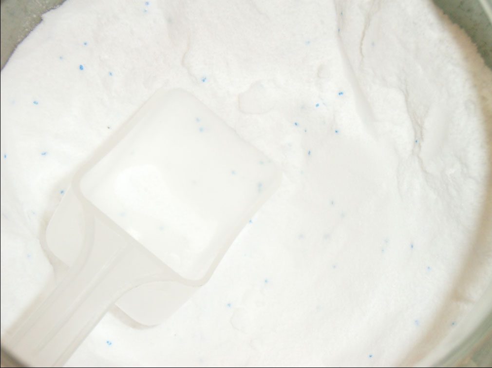 A spoon of white biological washing powder