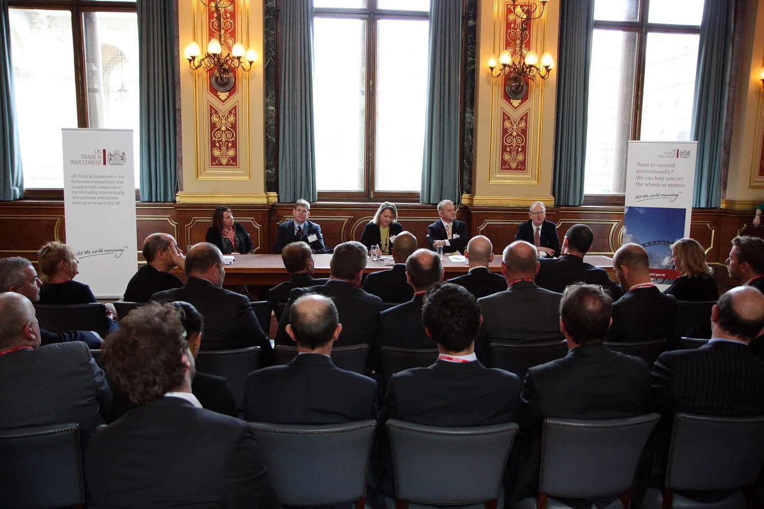 Managers in a business meeting around a table
