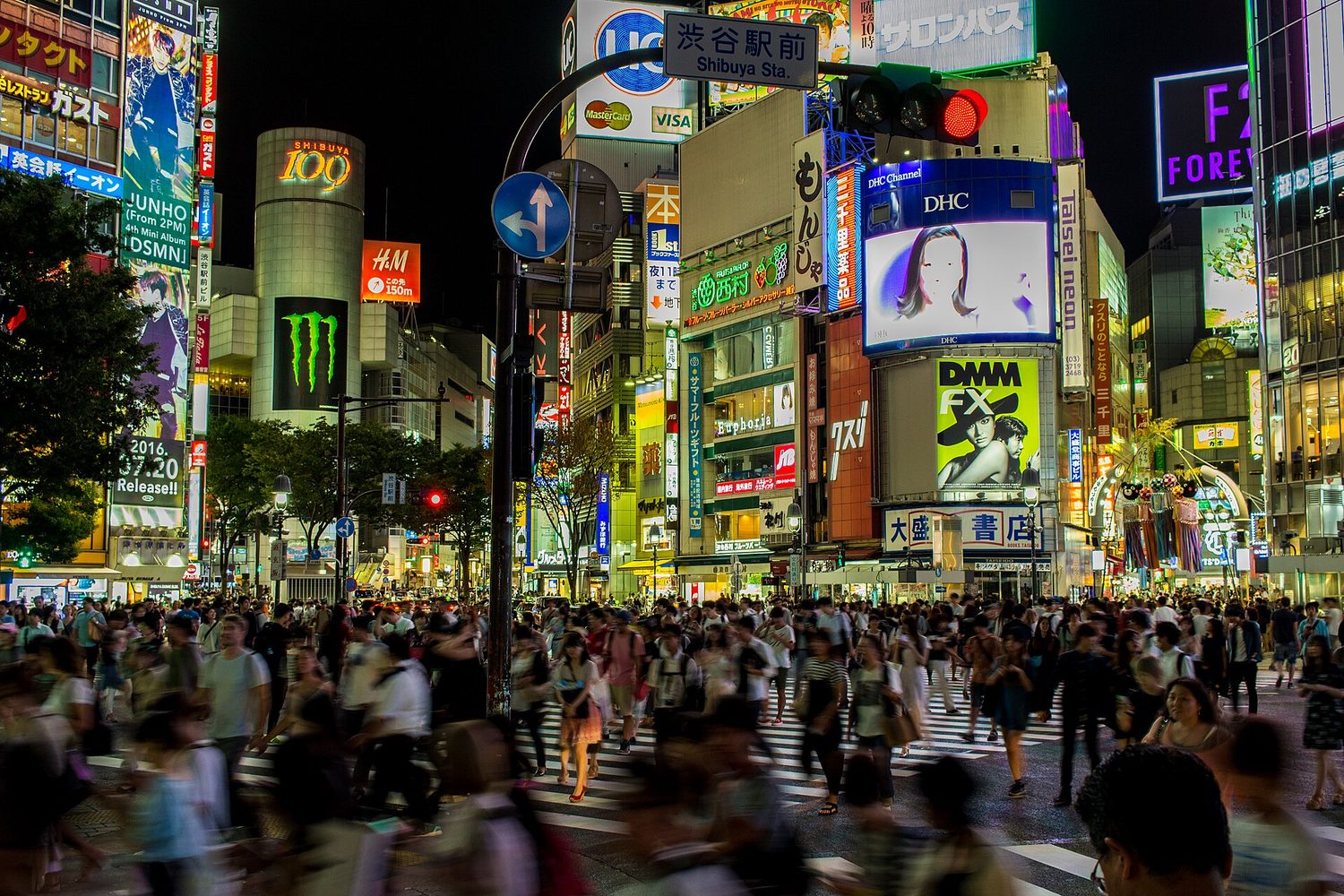 Giant advertising screens at a busy crossing