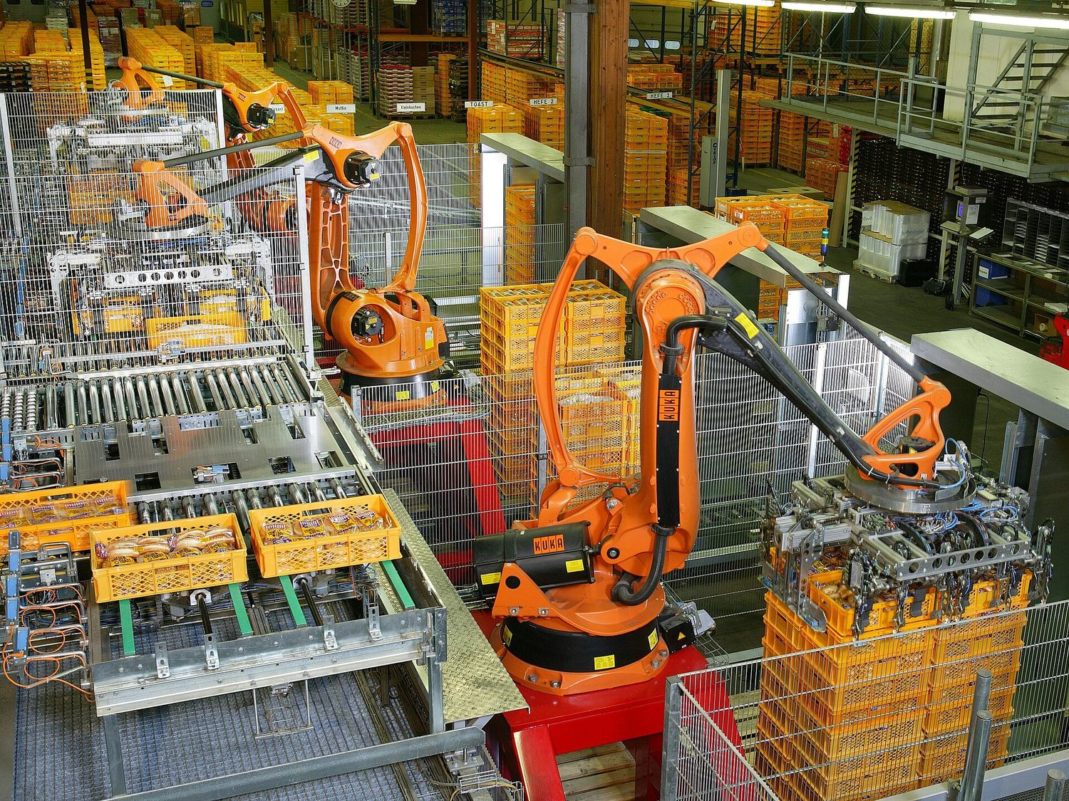 Robotic arms automating a factory production line