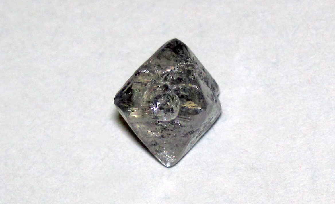 A rough octahedral diamond crystal