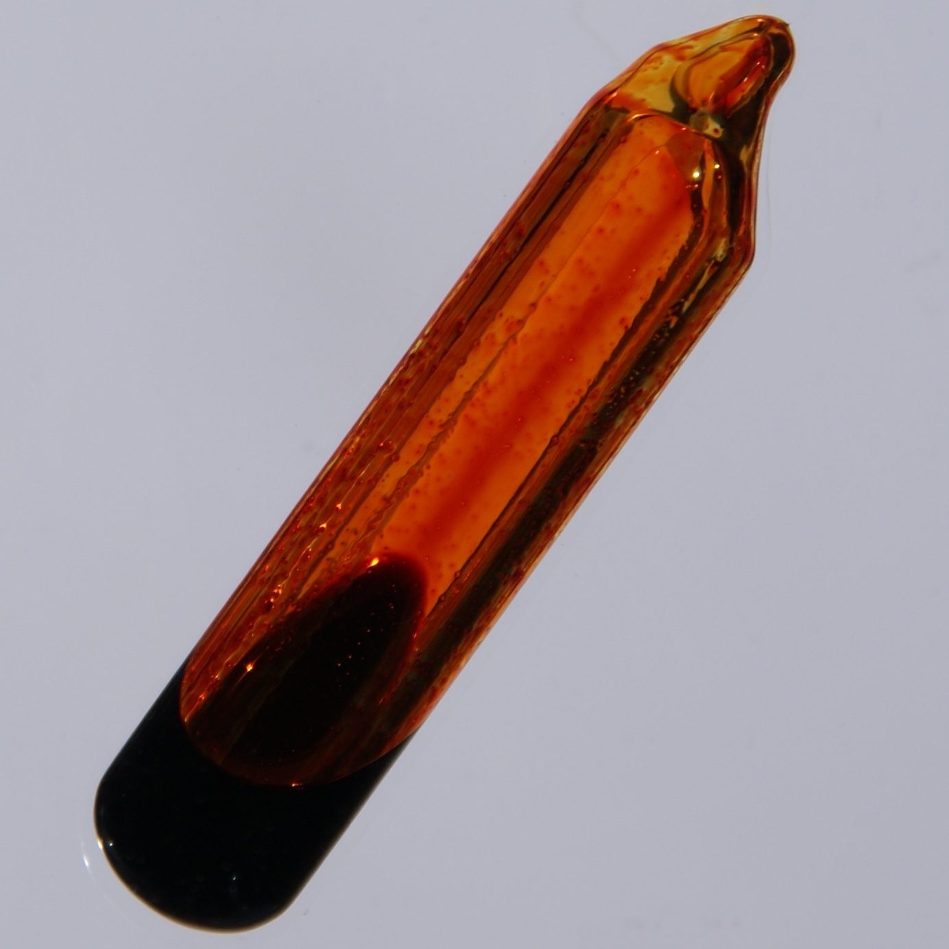Bromine: a dark liquid giving off an orange vapour in a sealed ampoule