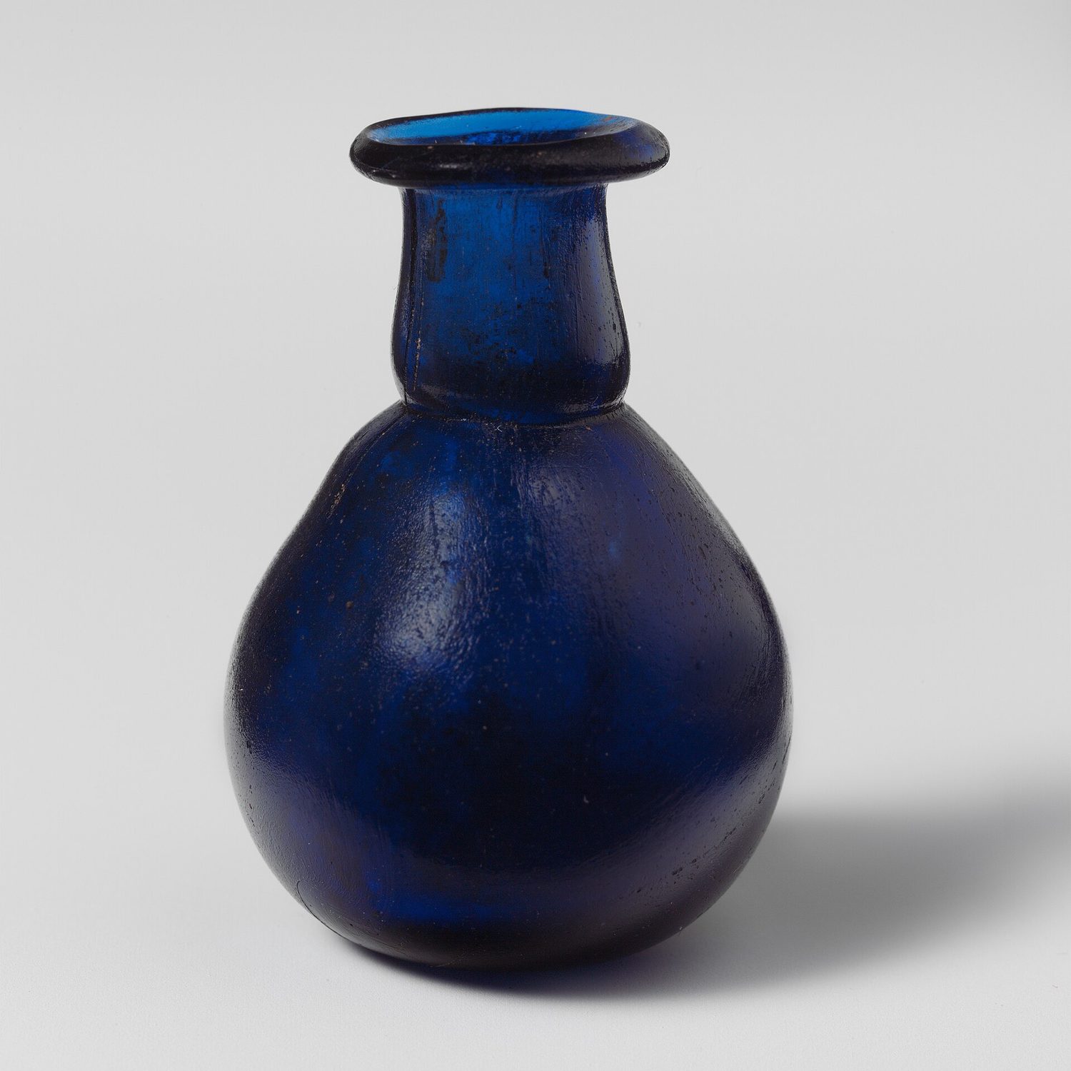 An ornate cut-glass perfume bottle