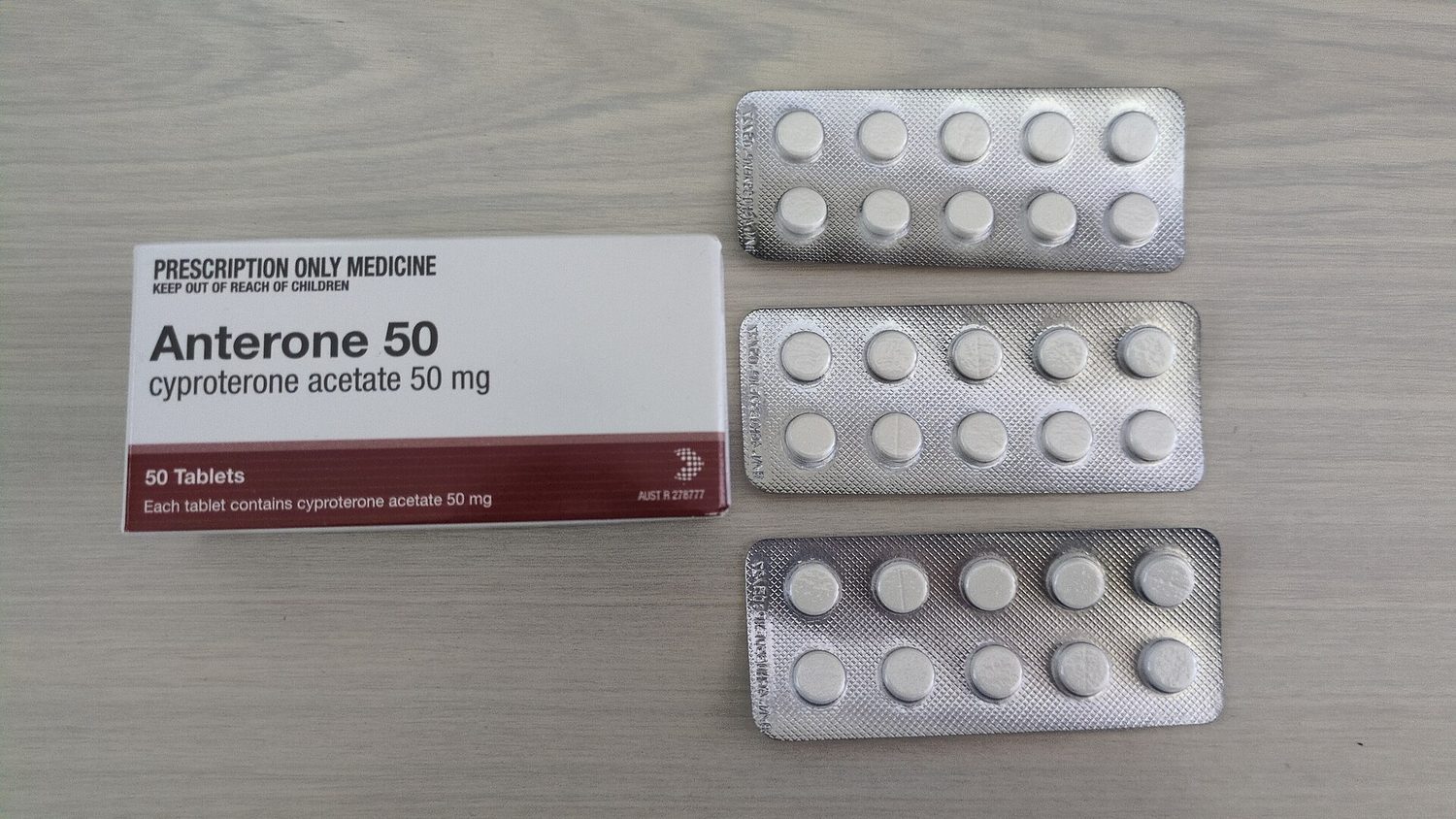 White tablets in foil blister packs