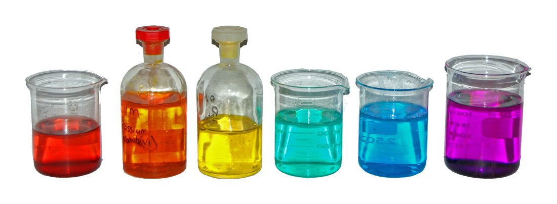 Six beakers of transition-metal solutions in a row, each a strong different colour: red, orange, yellow, green, blue and violet
