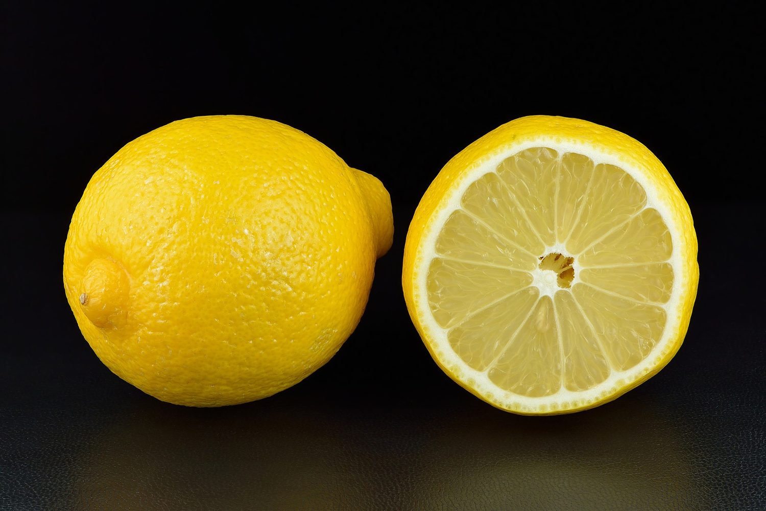 Whole and halved lemons