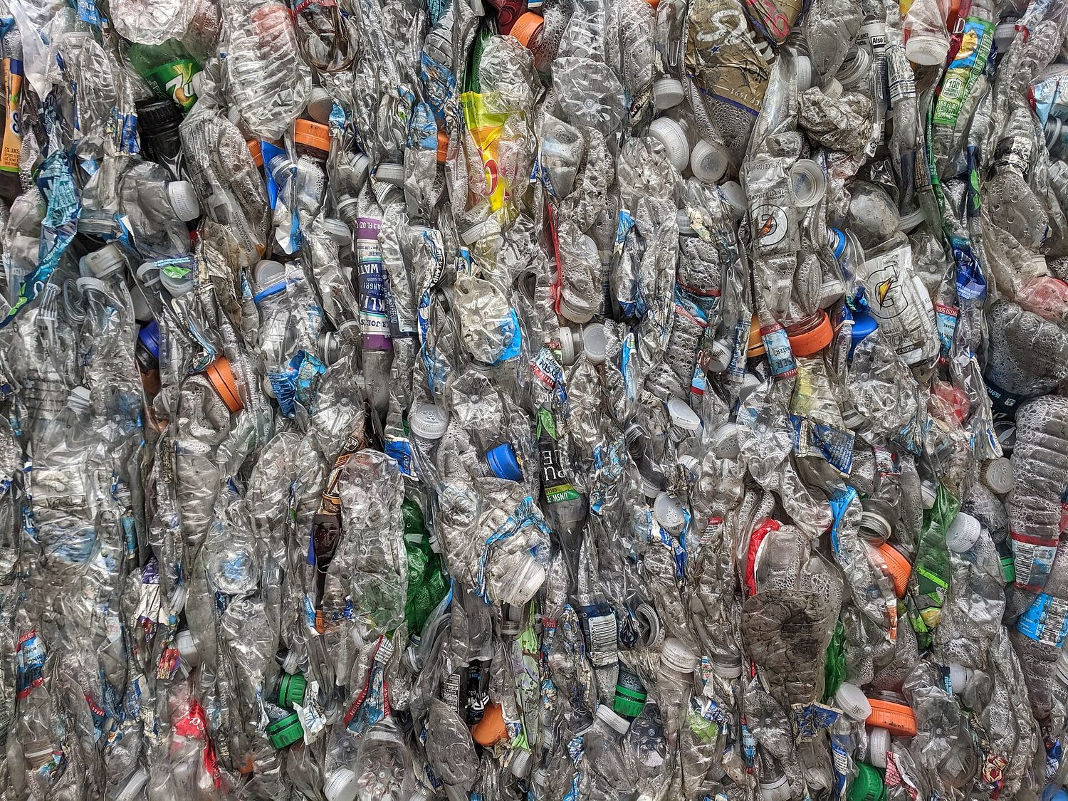A bale of crushed clear plastic drinks bottles