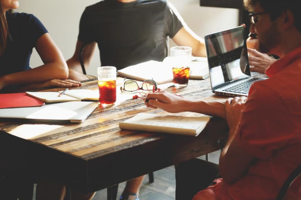 A software team collaborating around a table