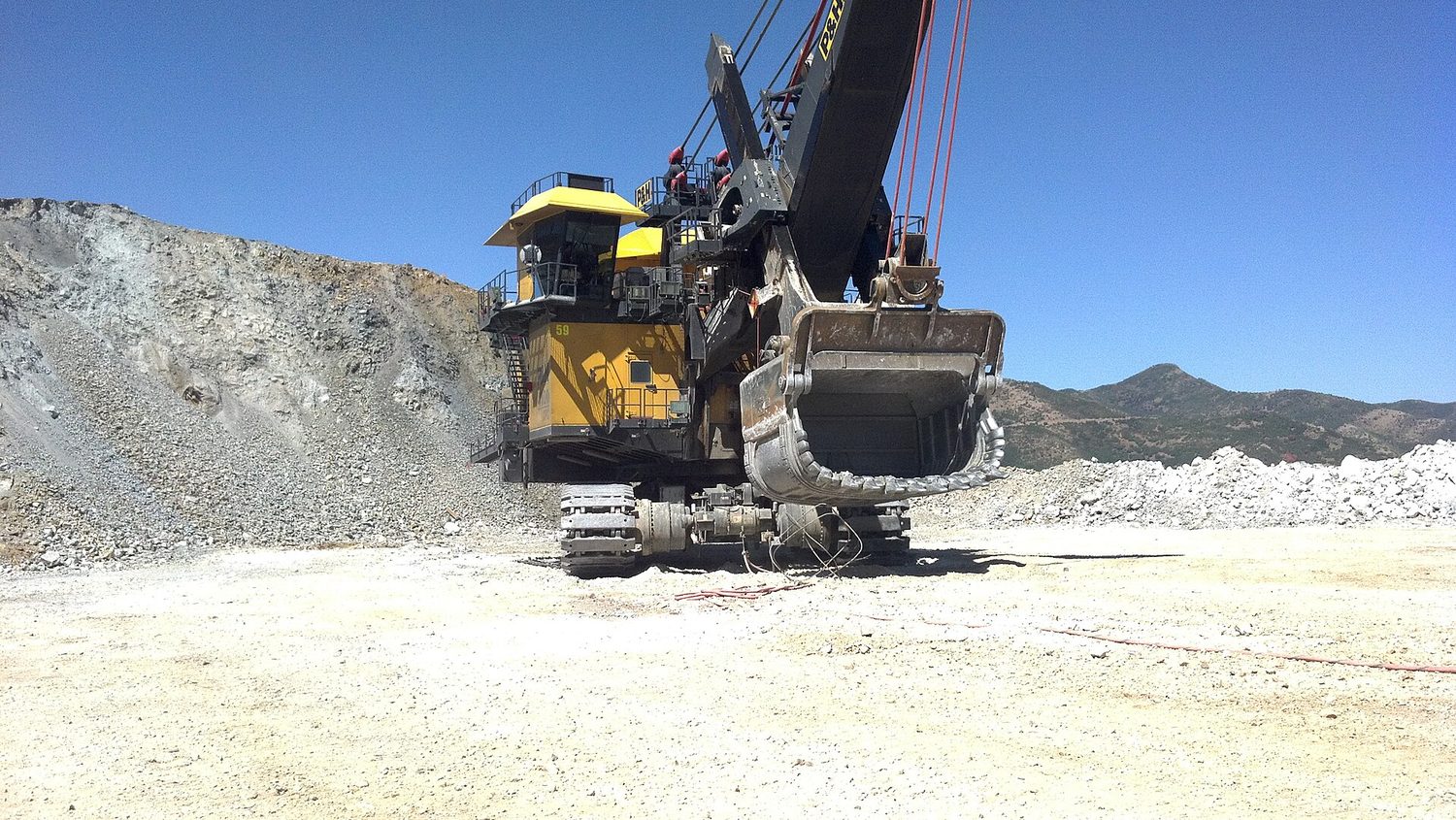 A mining excavator extracting ore at a surface mine