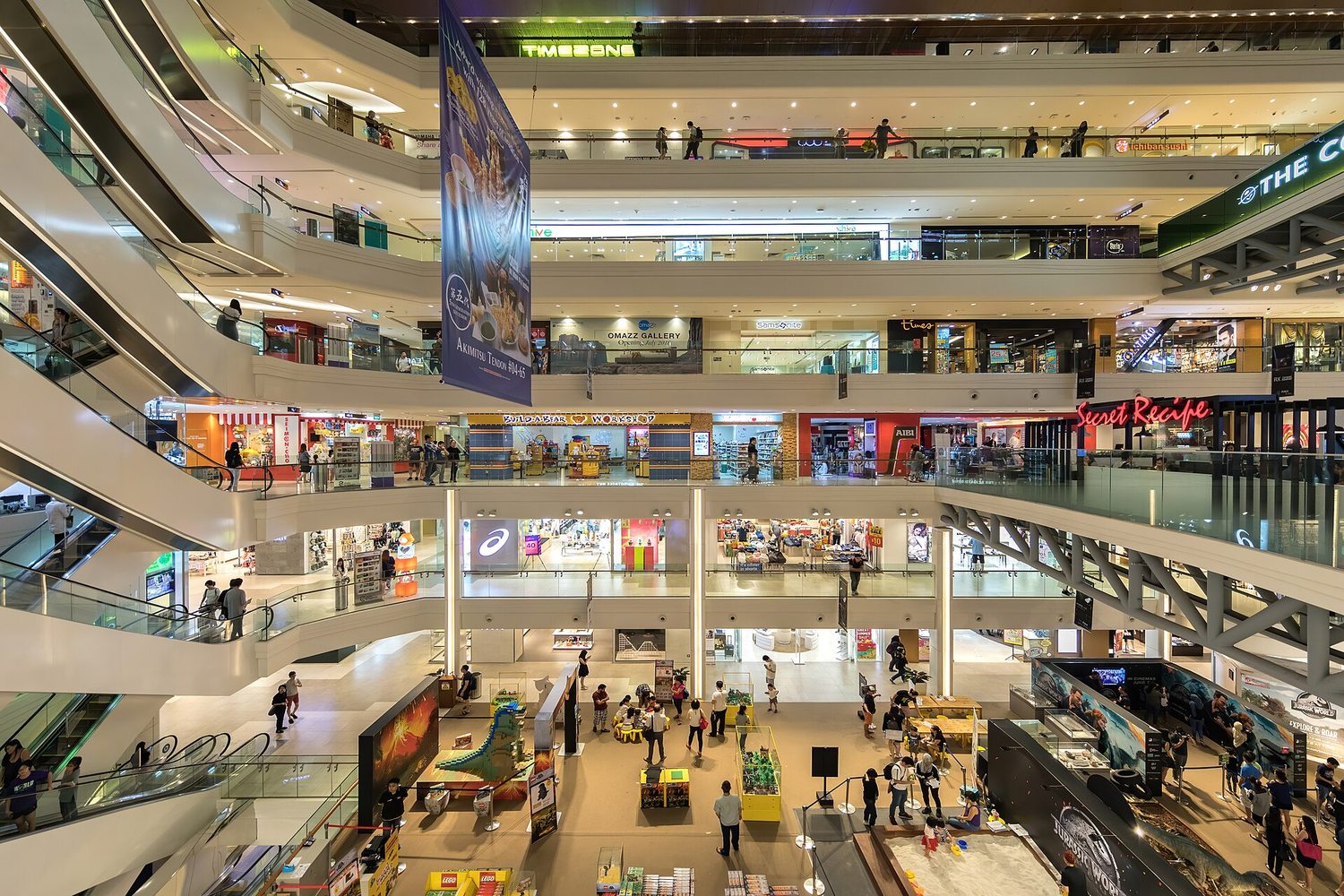 Shoppers in a busy shopping mall choosing what to buy