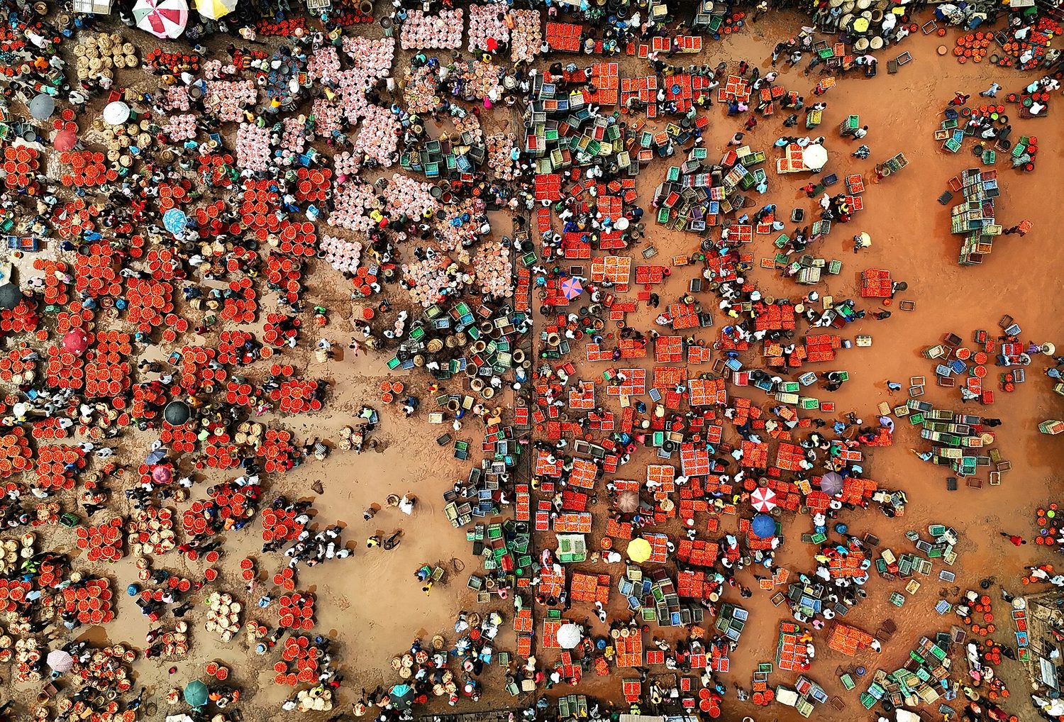An aerial view of a busy market in a developing economy
