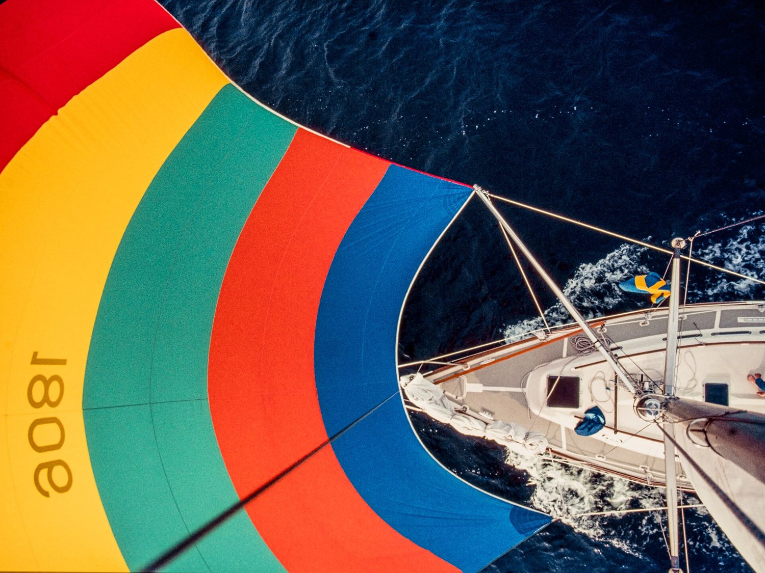 A sailing boat with a full spinnaker sail
