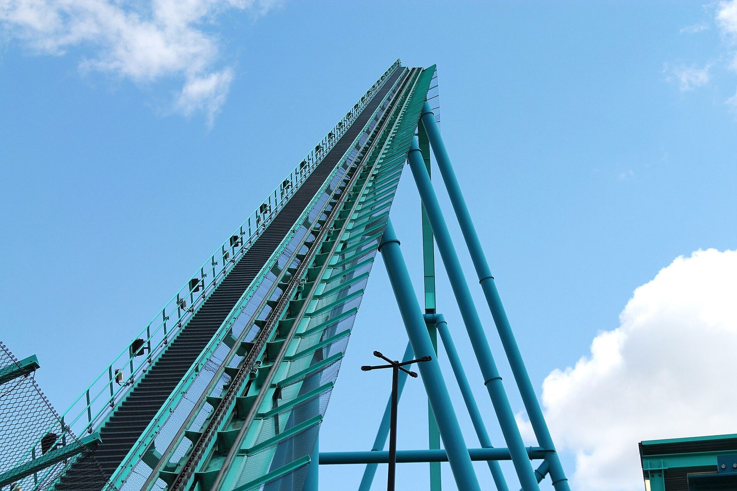 A roller coaster trades potential energy for kinetic energy
