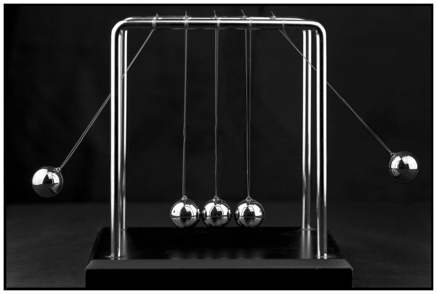 A Newton's cradle with steel balls