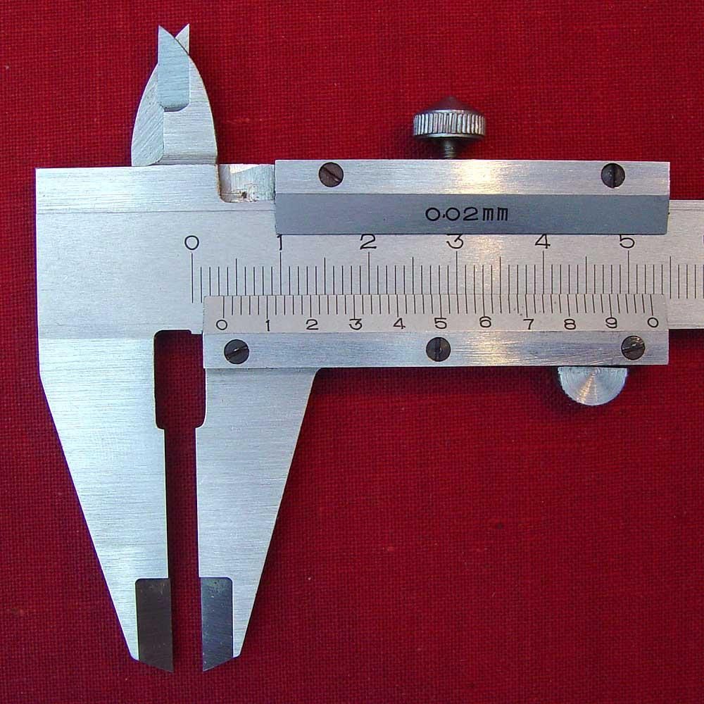 A vernier caliper measuring an object