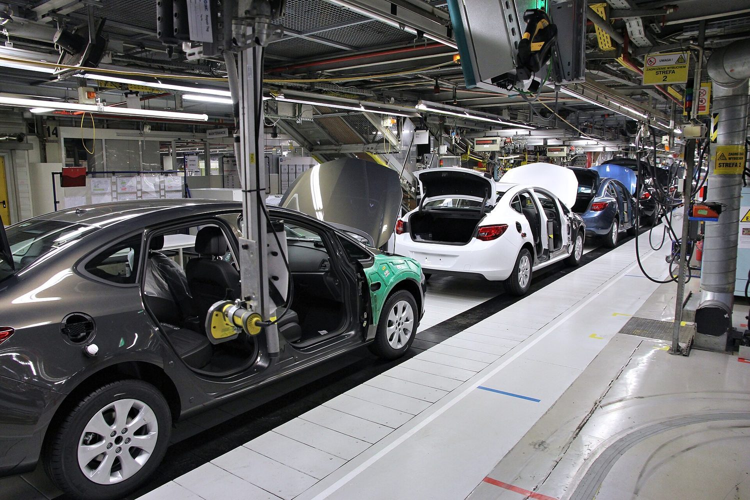 An assembly line: loops repeat a process for every item, like for and while