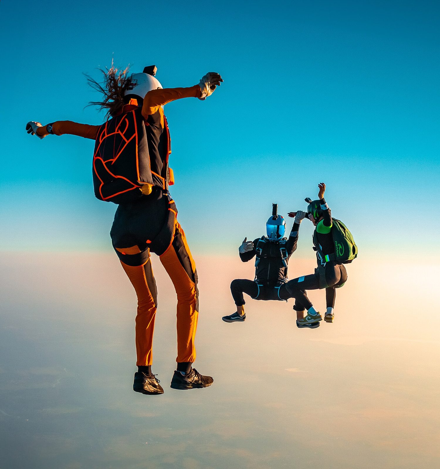 Skydivers in freefall: drag grows with speed until it balances weight at terminal velocity