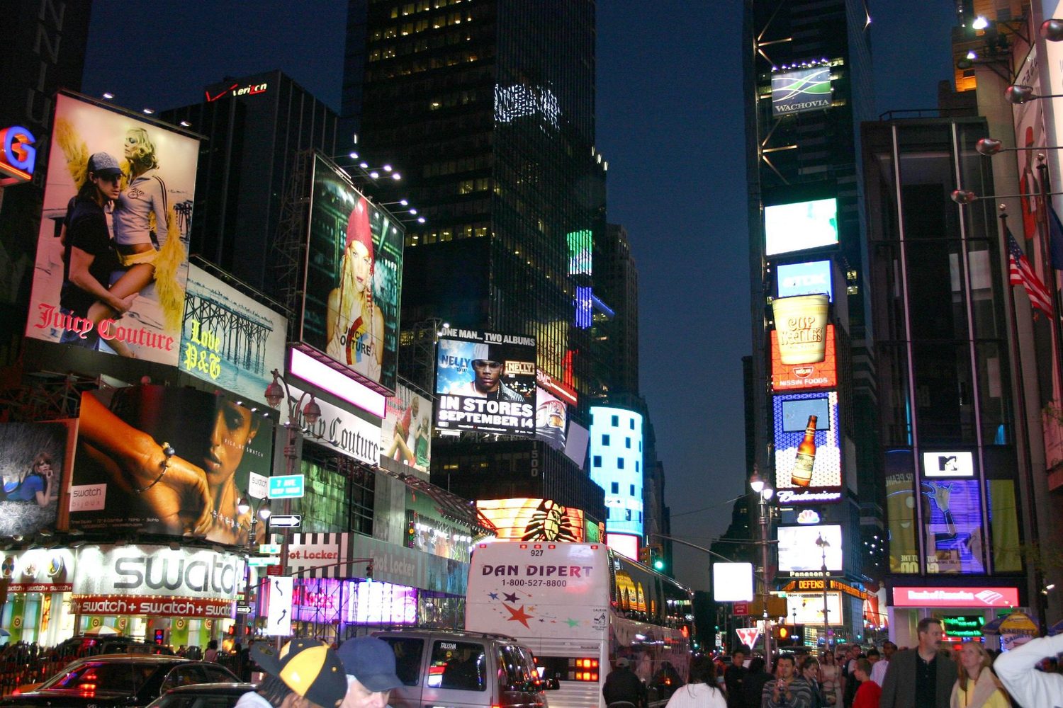 Giant advertising screens at a busy crossing