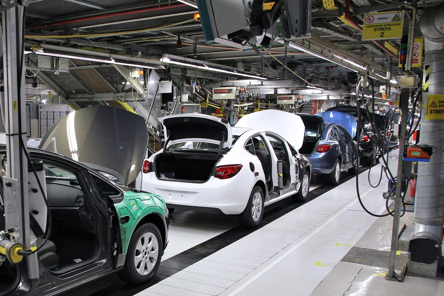 A car assembly line: making many identical products on a moving line