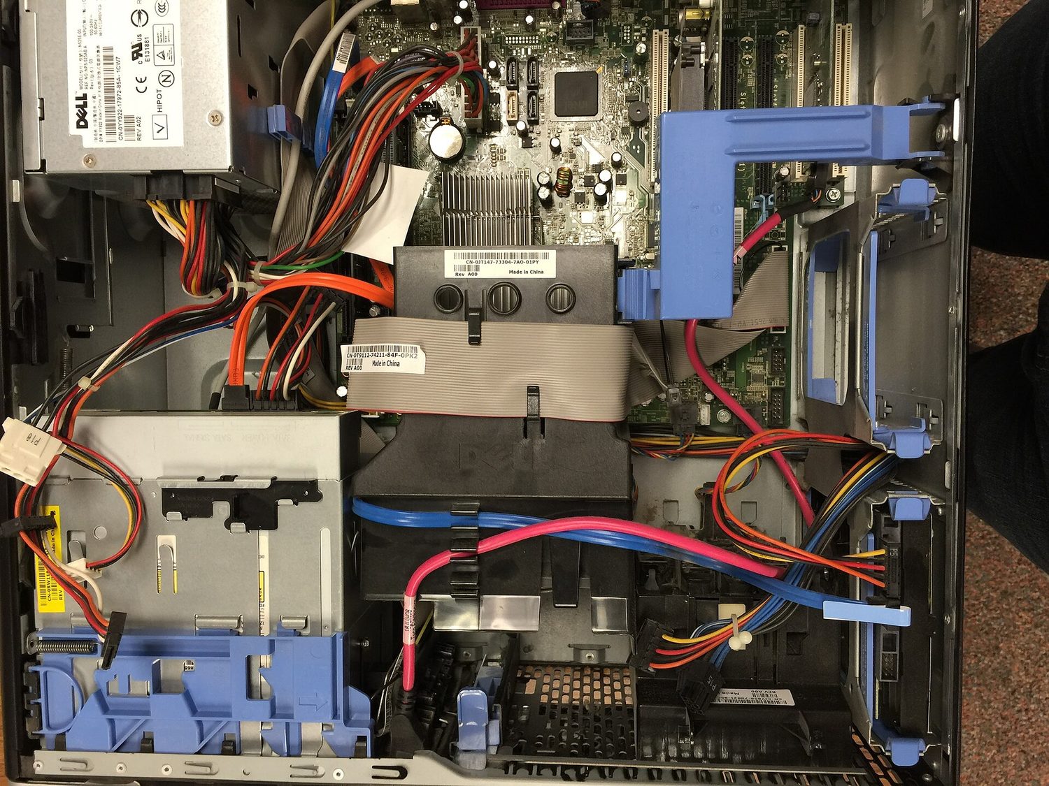 The motherboard and the parts attached to it are hardware — the physical parts of a computer.