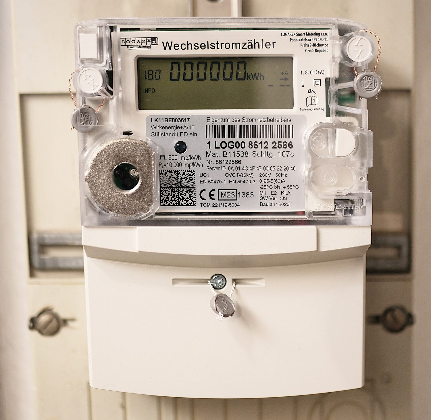 A modern household electricity meter with a digital display reading zero kilowatt-hours