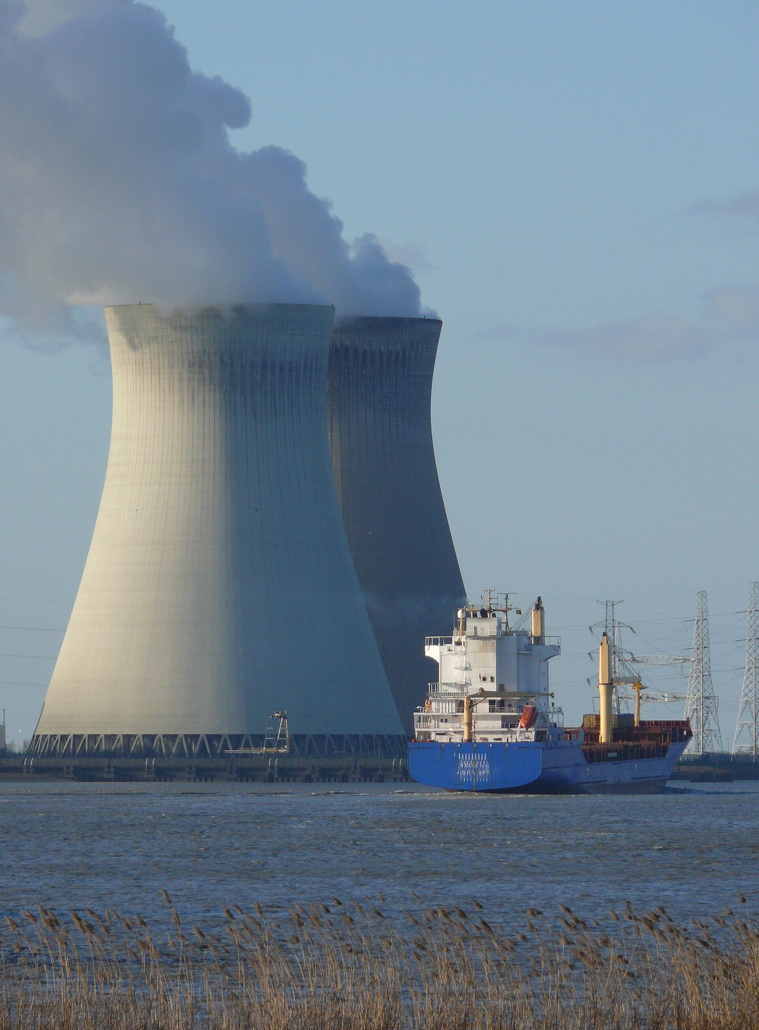 A nuclear power station; the large towers release waste heat as steam