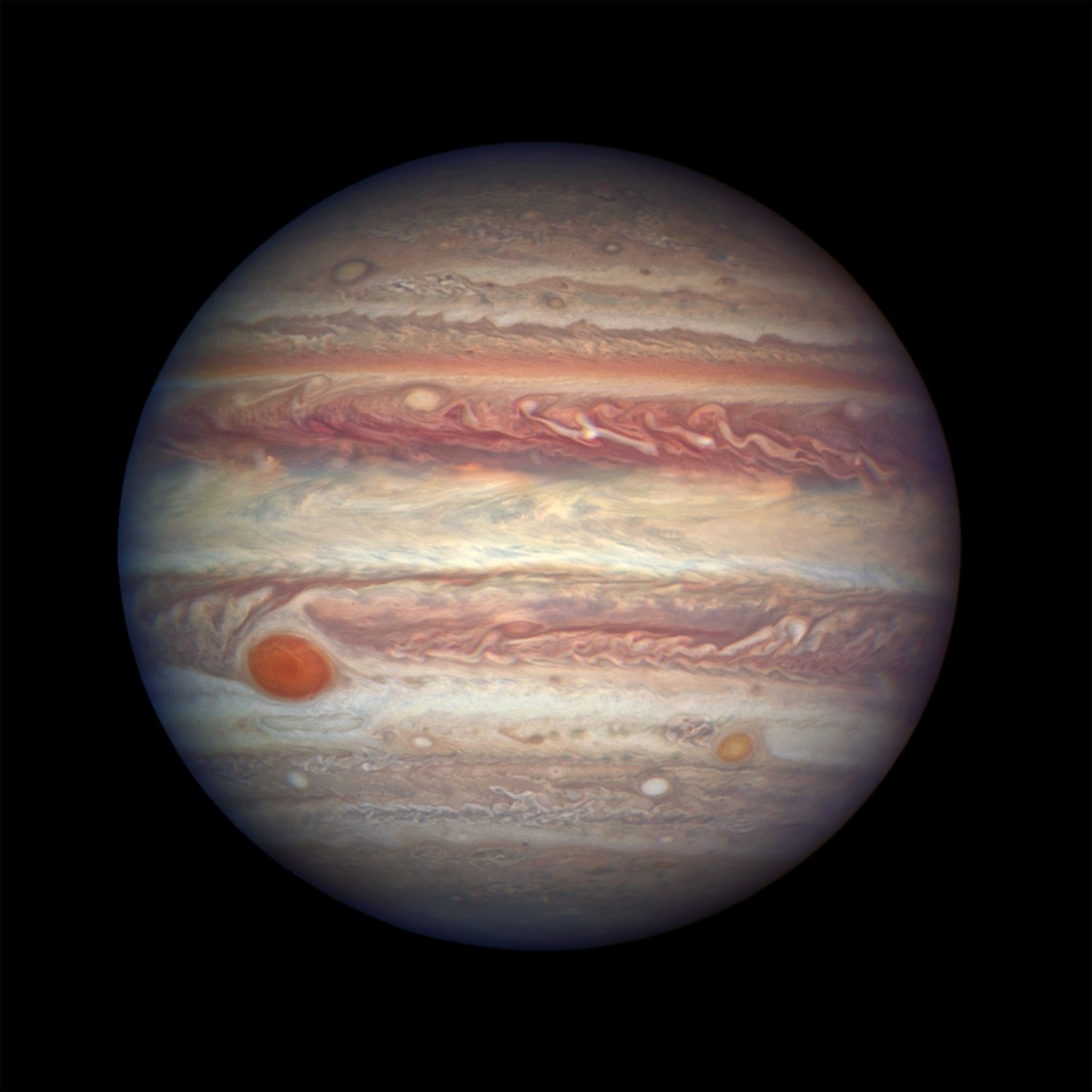 Jupiter, the largest planet, with its swirling bands of gas